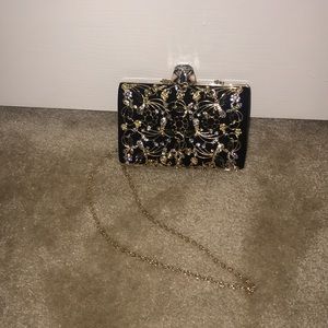 Black / Gold clutch bag
